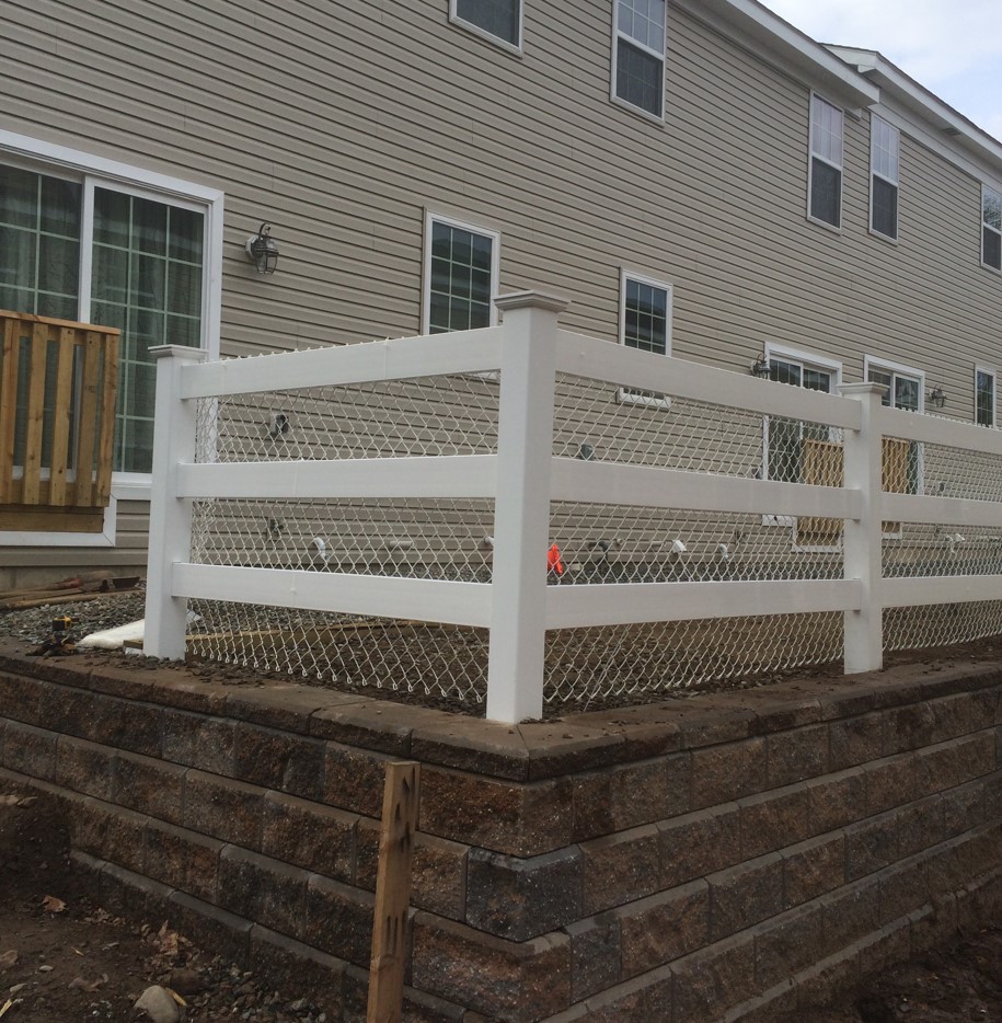 post and rail fence with white chain link